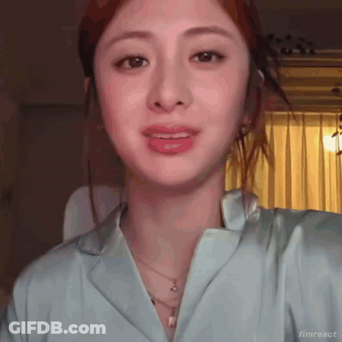 Baby Making Funny Face Sitting In Front Of Wall GIF