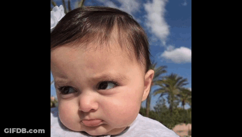 Baby Making Funny Face With Blue Sky GIF