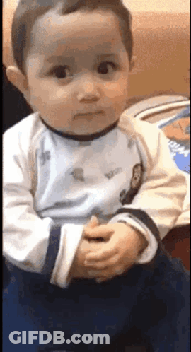 Baby Making Funny Face With Folded Hands GIF