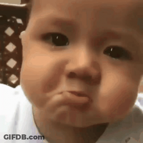 Baby Making Funny Face With Tongue Out GIF