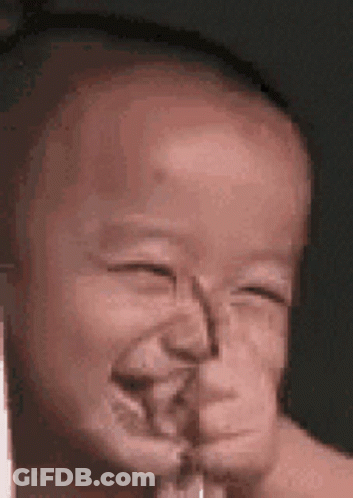 Baby Making Funny Face With Tongue Out GIF