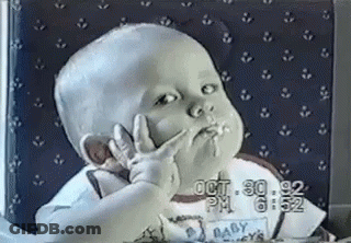 Baby Making Peace Sign While Eating GIF