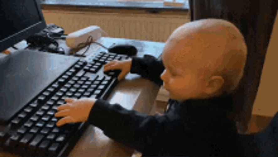 Baby Playing At The Computer GIF