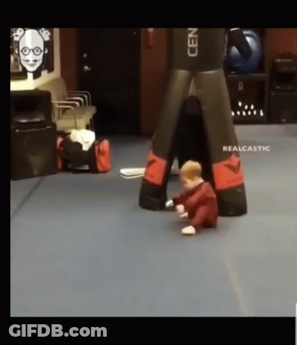 Baby Playing With Boxing Bag GIF
