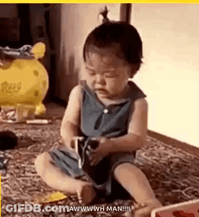 Baby Playing With Toy Funny Face GIF