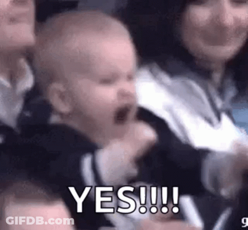 Baby Screaming In Crowd Held By Woman Saying Yes GIF