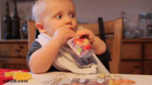 Baby Sitting At Table Eating From Bag GIF