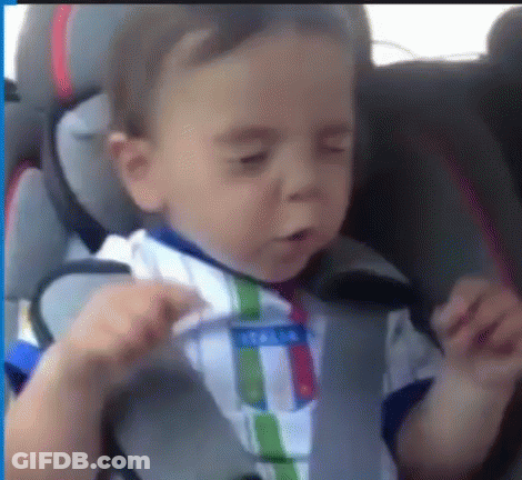 Baby Sitting In Car Seat With Eyes Closed And Striped Shirt GIF