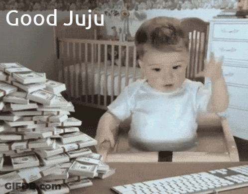 Baby Sitting In Front Of Money Giving Middle Finger GIF