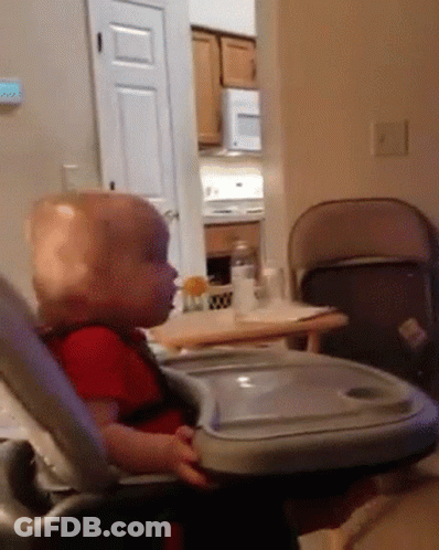 Baby Sitting In High Chair With Tray GIF