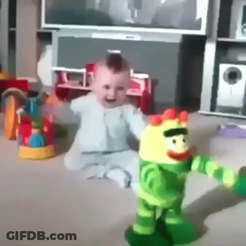 Baby Sitting On Floor Playing With Stuffed Toy GIF