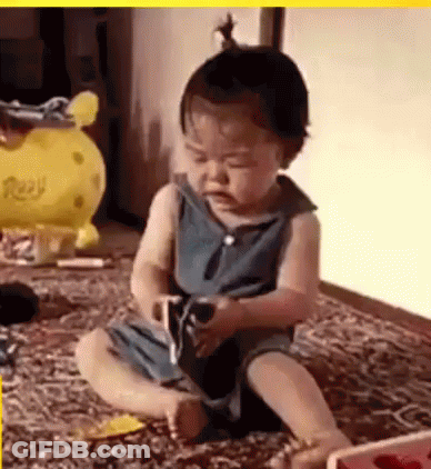 Baby Sitting On Floor Playing With Toy And Balloon GIF