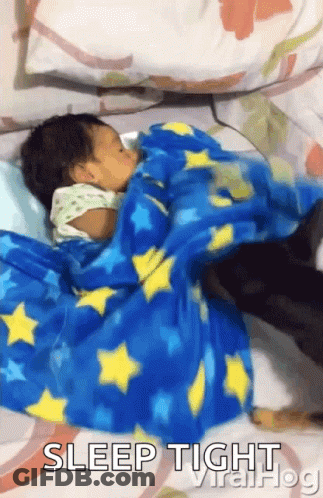 Baby Sleeping On Bed With Blue Star Blanket GIF