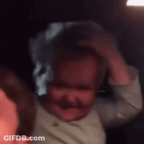 Baby Smiling And Making Funny Face GIF