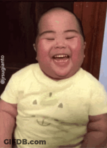 Baby Smiling In Yellow Smiley Shirt GIF