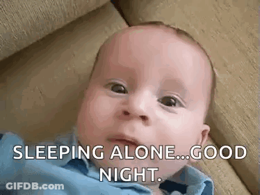 Baby Smiling Laying On Stomach Saying Good Night GIF