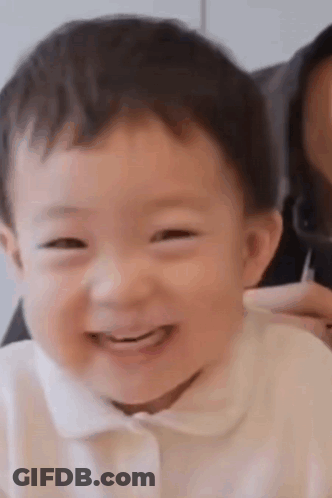 Baby Smiling Next To Woman GIF