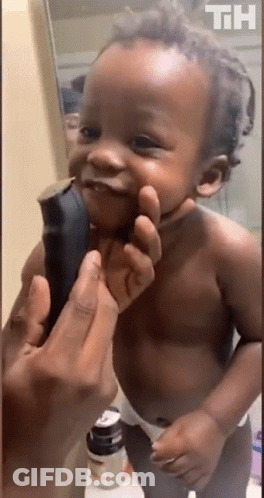 Baby Smiling While Held In Front Of Mirror GIF