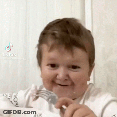 Baby Smiling With Fork In Mouth GIF