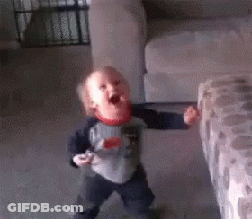 Baby Standing In Living Room With Mouth Open GIF