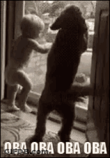 Baby Standing Next To Dog In Black And White GIF
