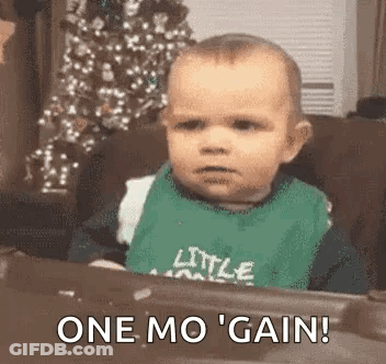 Baby Statue In Bib Saying I Love King Cake GIF