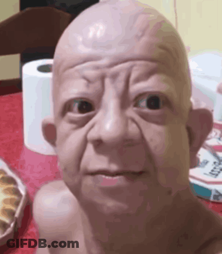 Baby Statue Sitting Next To Toilet Paper GIF