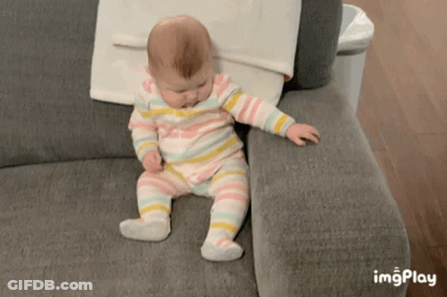 Baby Striped Outfit Sitting On Couch Imgplay GIF
