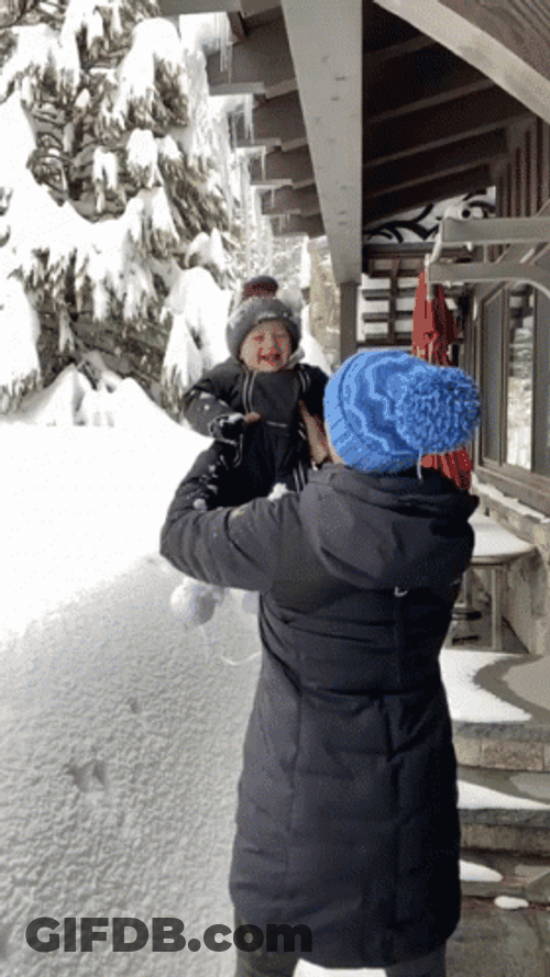 Baby Thrown Into Snow On Snow Day GIF
