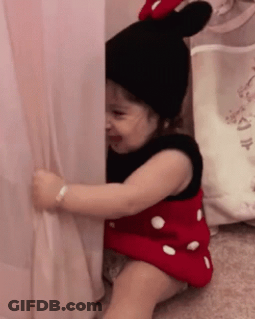 Baby Trying To Hide With Curtain GIF