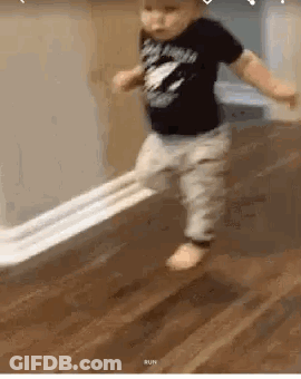 Baby Walking On Floor Holding Toilet Paper GIF