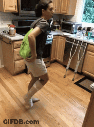 Baby Waving In Crib GIF