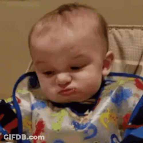 Baby Wearing Bib Making Funny Face GIF