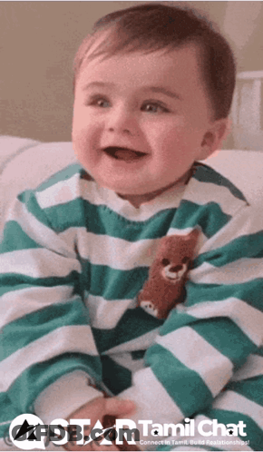 Baby Wearing Green And White Striped Shirt With Teddy Bear GIF