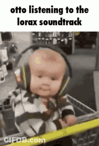 Baby Wearing Headphones In Shopping Cart GIF