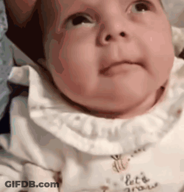 Baby Wearing Let's Grow Shirt GIF