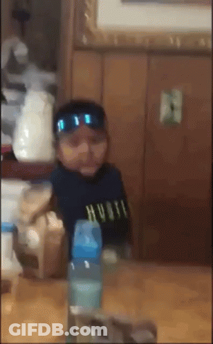 Baby Wearing Sunglasses And Hustle Shirt GIF