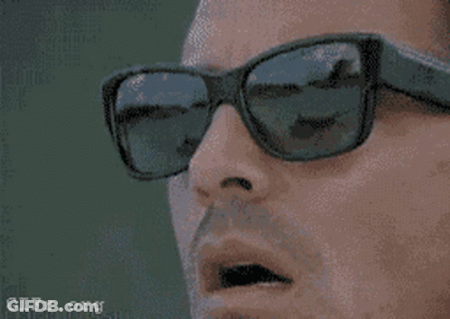 Baby Wearing Sunglasses Sitting With Water Bottle GIF