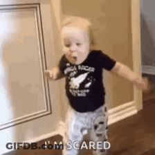 Baby With Arms Outstretched In Hallway GIF