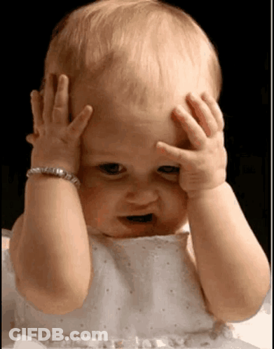 Baby With Bracelet Covering Face GIF