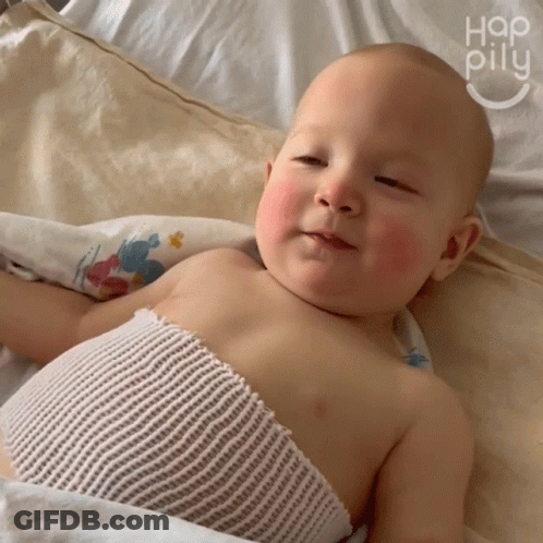 Baby With Chest Bandage Laying On Bed Hap Pillu GIF