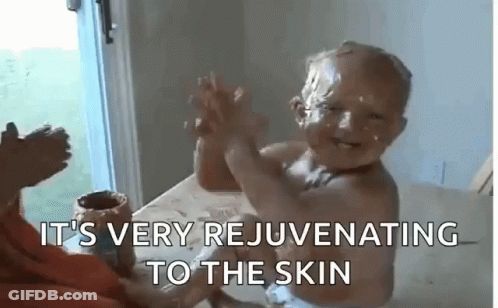 Baby With Chocolate Face Giving High Five GIF