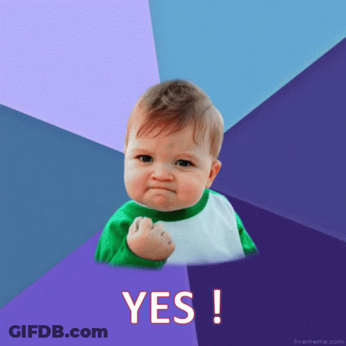 Baby With Fist In The Air Saying Yes GIF