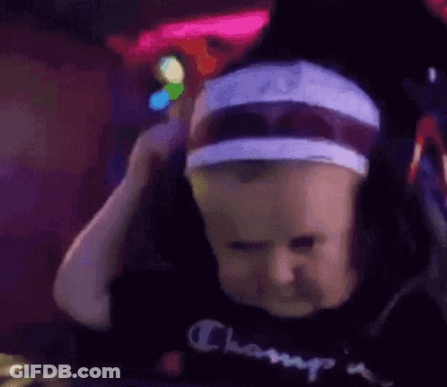 Baby With Headphones And Headband Making Funny Face GIF