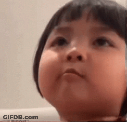 Baby With Short Hair Making Funny Face GIF