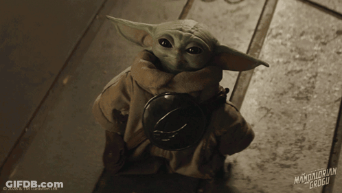 Baby Yoda Holding Helmet GIF