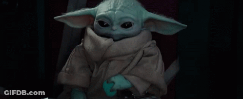 Baby Yoda Holding Sword Looking At Camera GIF