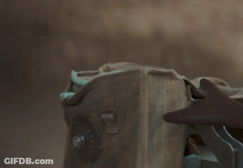 Baby Yoda Looking Out Of Box With Screw GIF