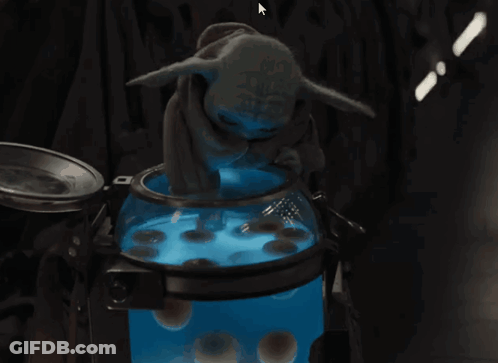 Baby Yoda Sitting In Front Of Blue Bowl GIF