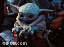 Baby Yoda Sitting On Lap With Cane GIF